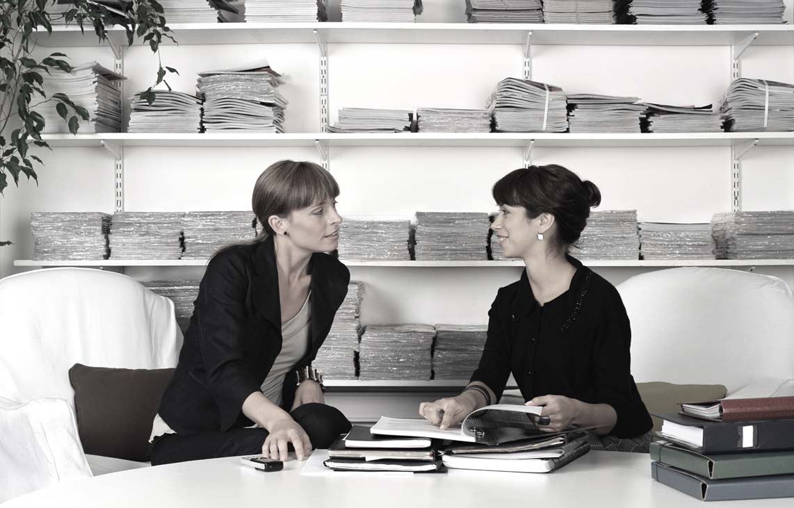 Two office workers having discussion